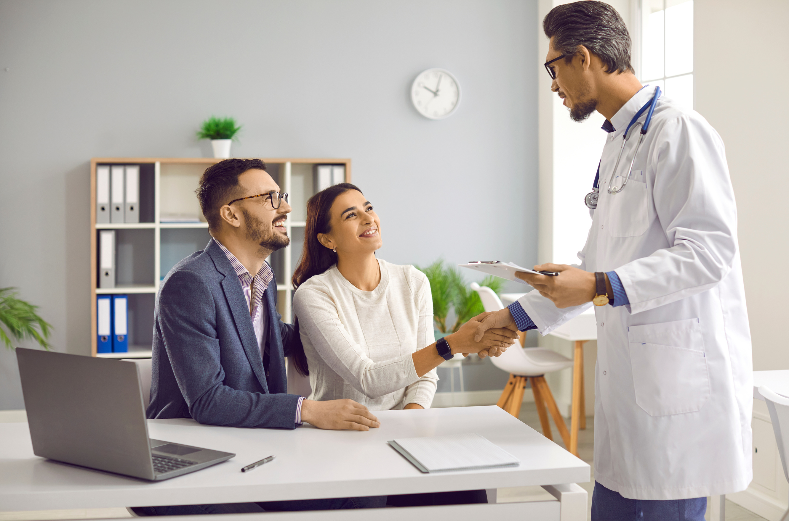 Young Couple Planning Pregnancy and Seeing Doctor for Consultation on IVF Treatment